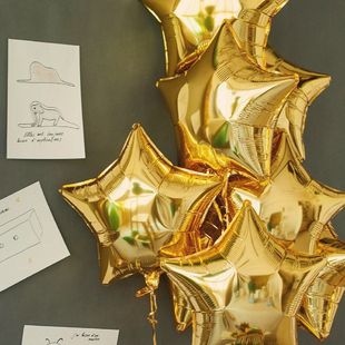 Букет из 7 золотых шаров-звёзд фото